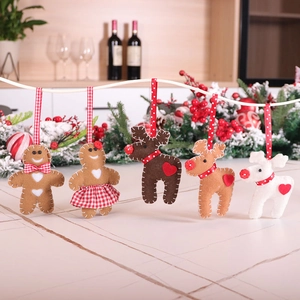 Handmade felt Christmas tree ornaments set with gingerbread man and reindeer hanging charms