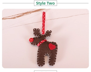 Detail of a handmade brown felt reindeer ornament with red heart and white stitching