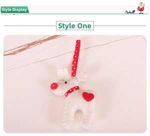Close-up of felt reindeer ornament with red heart details and polka dot ribbon for Christmas