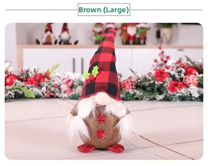 Close-up of large brown Christmas gnome in red buffalo plaid hat with snowflake embroidery