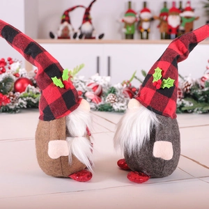 Christmas faceless gnomes with red plaid hats and sequin feet in cozy holiday scene