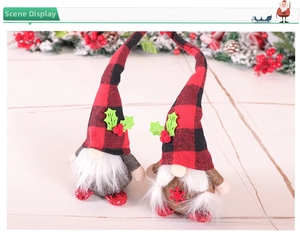 Detail of two Christmas gnomes with red and black plaid hats and white faux fur beards