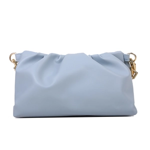 Detail of light blue cloud bag with pleated leather texture and gold metal chain