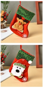 Detail of red felt Christmas stockings with reindeer, polar bear, and green sequins
