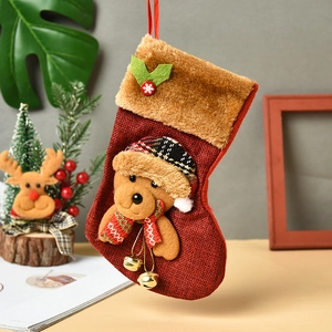 Hanging Christmas stocking with cute plush bear, golden bells and faux fur trim decor