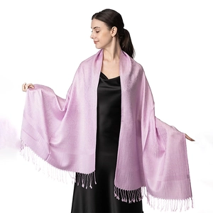 Detail of light purple jacquard pashmina shawl with soft fringe and elegant texture