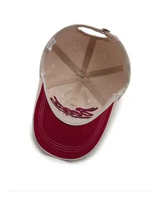 Detail view of cotton baseball cap interior with stitching, vent holes and embroidery