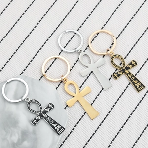 Set of four ancient Egyptian Ankh symbol keychains in gold, silver, and black metal finishes