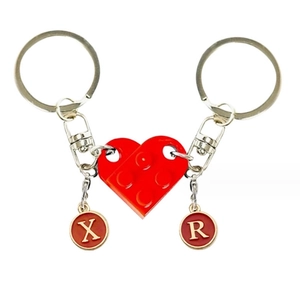 Creative red heart block keychain set with X and R letter tags for couples' backpacks