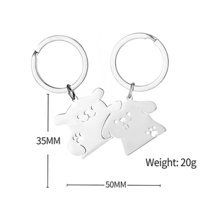 Cute cartoon puppy stainless steel couple keychain showing dimensions 35mm by 50mm