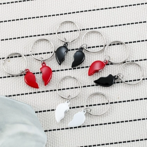Magnetic heart-shaped metal keychains for couples in multiple colors, perfect for gifting