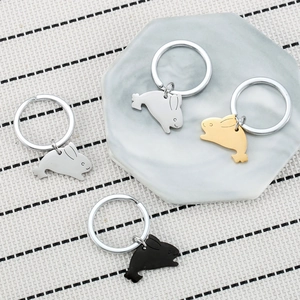Minimalist stainless steel rabbit keychains in silver, gold, and black colors