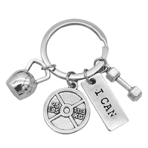 Silver fitness keychain with kettlebell, barbell plate, I CAN tag and dumbbell pendant