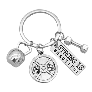 Silver fitness keychain with dumbbell, kettlebell and Strong is Beautiful charm pendants