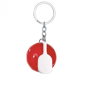 Close-up of a silver pickleball keychain with a red ball and white paddle pendant