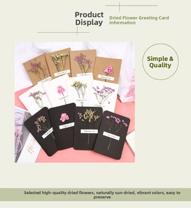 Detail of assorted handmade greeting cards with natural dried flowers and elegant lettering