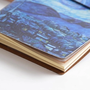 Portable Van Gogh Starry Night journal with premium faux leather cover and protective sleeve
