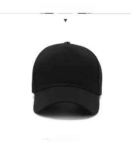 Detail view of the five-panel construction and curved brim of the black cotton baseball cap
