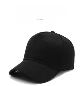 Close-up of black cotton twill baseball cap showing fine fabric texture and seams