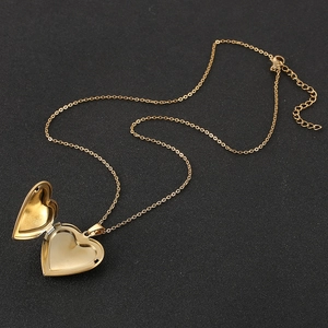 Gold stainless steel heart locket necklace with open photo frame and extension chain