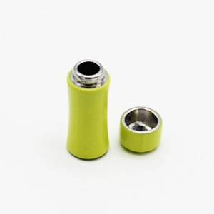 Detail view of miniature dollhouse thermos in yellow-green with detachable lid
