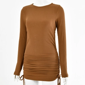 Detail of brown ribbed knit dress featuring adjustable side drawstrings and ruched hem