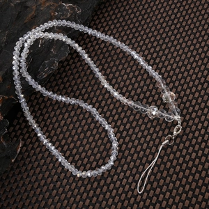 Detailed shot of multi-faceted crystal beads phone strap with sturdy metal clasp