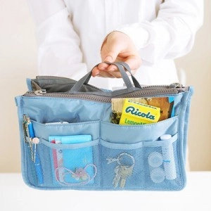 Blue nylon bag-in-bag organizer with dual zippers and multiple mesh storage pockets