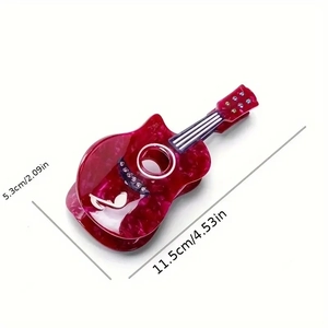 Red marble guitar hair claw clip with colorful rhinestones and music notes motif