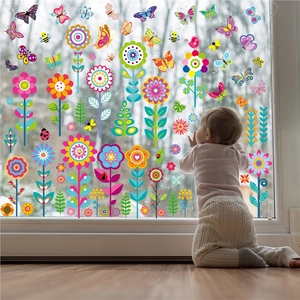 Toddler by window showing double-sided floral butterfly spring decals decoration