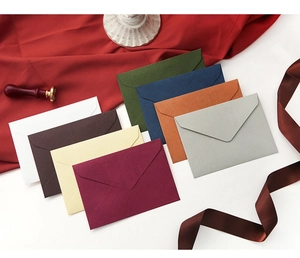Detailed view of high-quality textured paper envelopes in various elegant colors