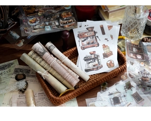 Detail of vintage scrapbooking stickers with coffee and pastry motifs in a rustic setting