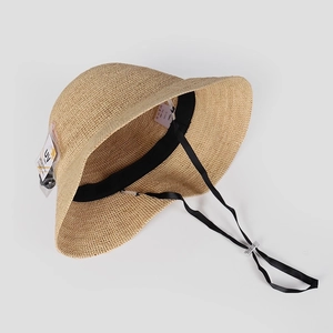 Handmade raffia bucket hat for women with adjustable wind strap and UV protection