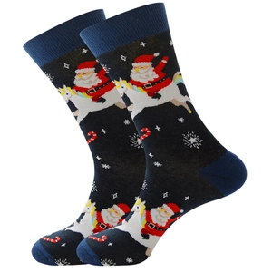 Detail of Christmas crew socks featuring Santa riding a unicorn with snowflake patterns