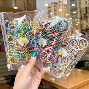 Macro shot of colorful high-elastic hair ties in transparent daisy zipper bags