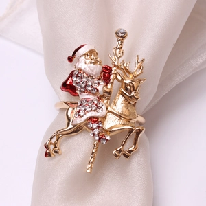 Christmas napkin ring featuring a gold Santa Claus on a reindeer with sparkling rhinestones