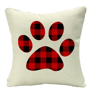 Christmas linen throw pillow with red and black buffalo plaid dog paw print pattern