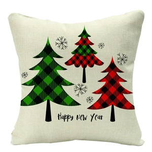 Detail of Christmas pillowcase with plaid trees and Happy New Year text on linen fabric