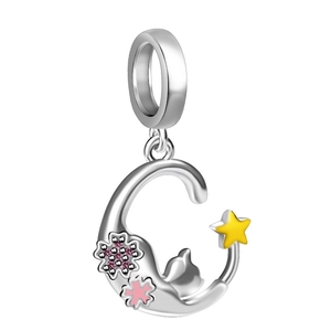 Detail of silver cat on moon charm with pink cherry blossoms and yellow star stones