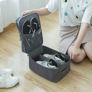 Detail view of grey waterproof oxford shoe bag showing interior storage for sneakers