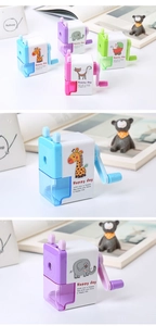 Close-up of colorful cartoon animal pencil sharpeners in blue, pink, and green colors