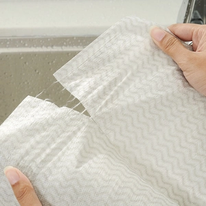 White disposable cleaning cloth with wave pattern showing high tear resistance and durability