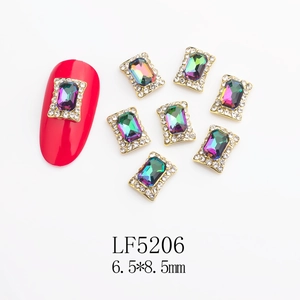 Detailed view of 6.5x8.5mm iridescent nail art charm with gold setting and LF5206 marking