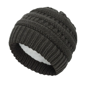 Close-up of thick knit winter baby hat with soft white fleece lining for warmth