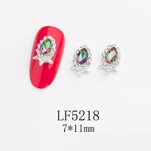 Detail of 7x11mm teardrop nail crystals with silver base and aurora glass gemstones