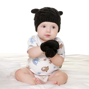 Infant knitted hat and mitten set with cute bear ears in classic black winter style