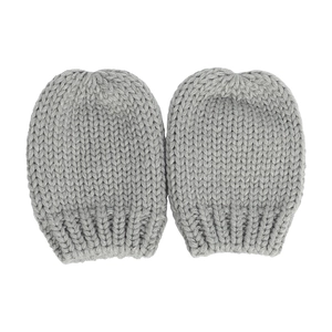 Detailed view of grey knitted baby mittens with thick texture and ribbed elastic cuffs