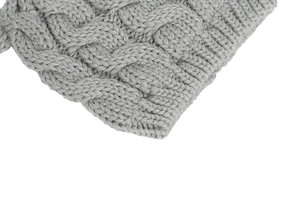 Detailed macro view of the classic gray cable-knit pattern on a soft baby winter hat