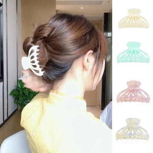 Detailed comparison of four marble patterned acetate claw clips in various pastel colors