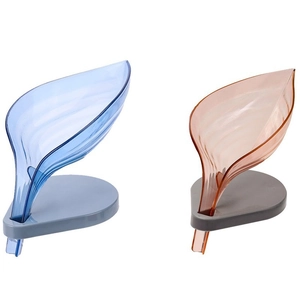Leaf-shaped soap dishes in blue and amber with automatic drainage for bathroom sinks